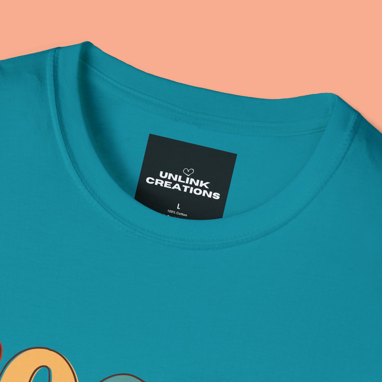 “FOCUS on the good” above a multicolored heart on this Unisex Softstyle T-Shirt.