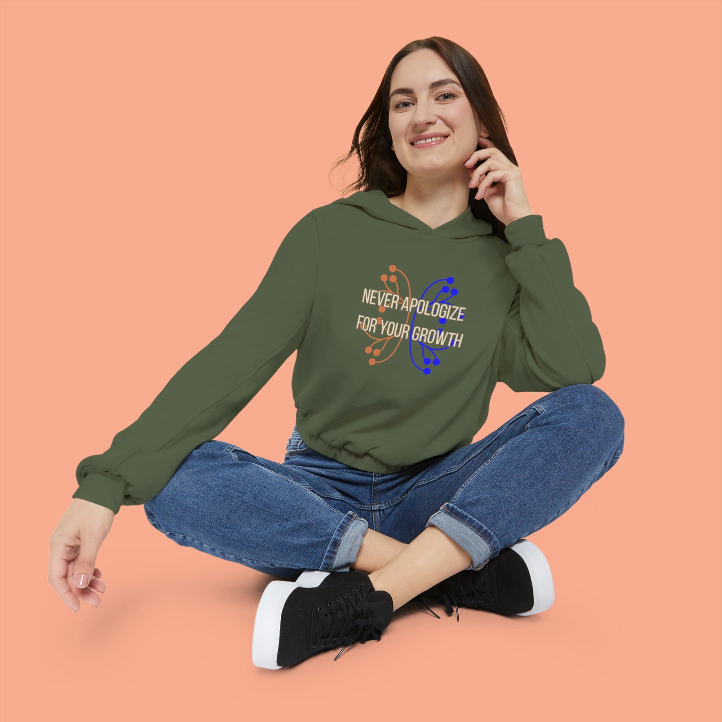 Never apologize for your growth is the message on this Women's Cinched Bottom Hoodie. Go and keep growing!