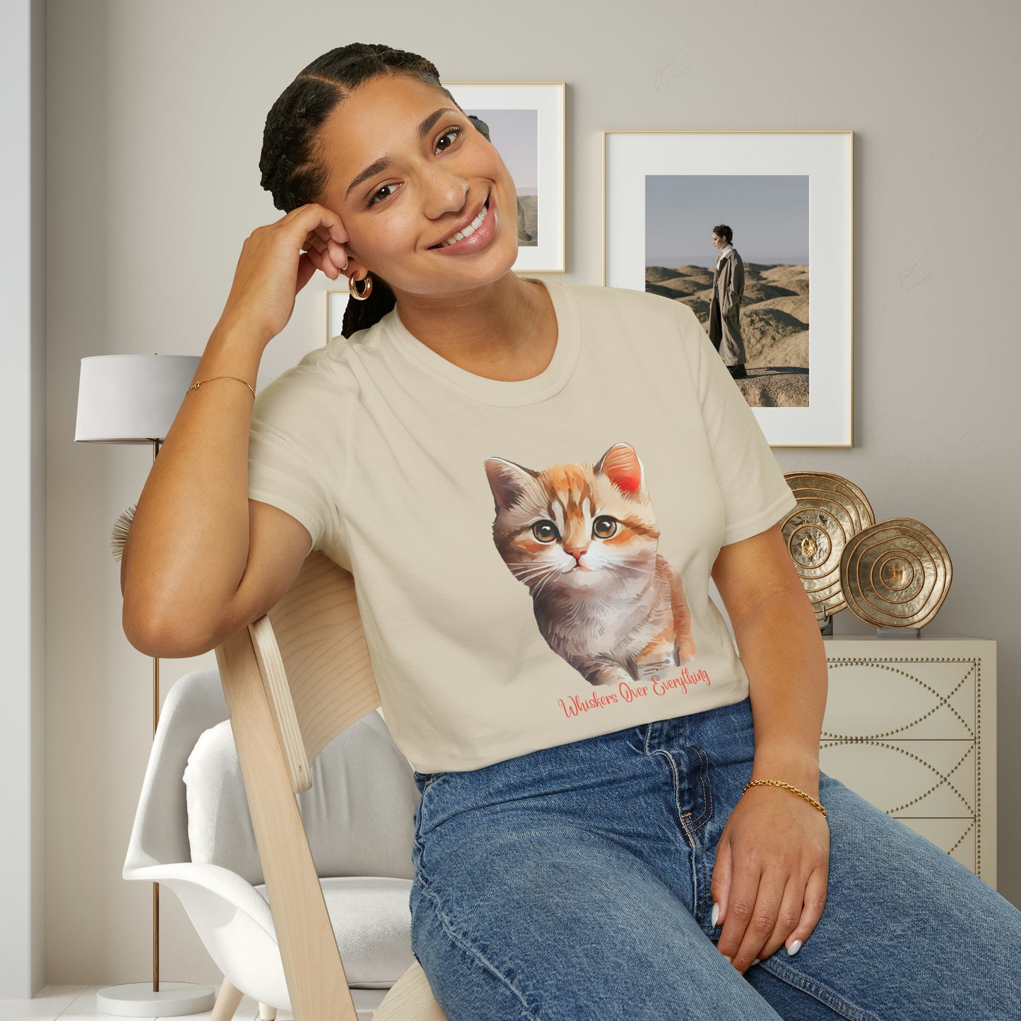 A cute cat with “Whiskers over everything” below it on this Unisex Softstyle T-Shirt. Cat lovers get this.