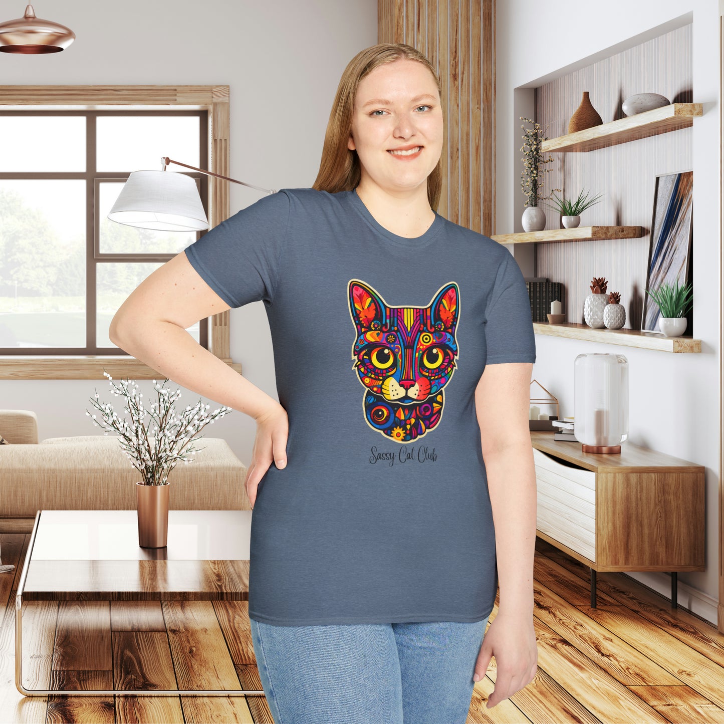 A mesmerizing cat that just pulls you to look into its eyes with “Sassy Cat Club” below it on this Unisex Softstyle T-Shirt.