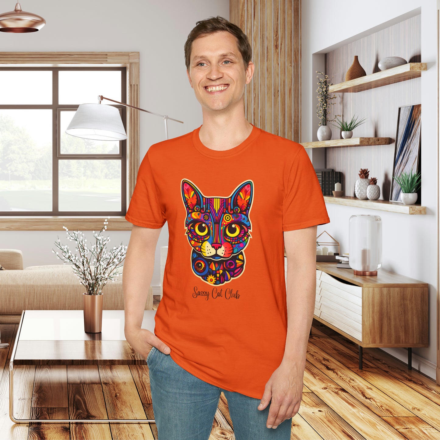 A mesmerizing cat that just pulls you to look into its eyes with “Sassy Cat Club” below it on this Unisex Softstyle T-Shirt.