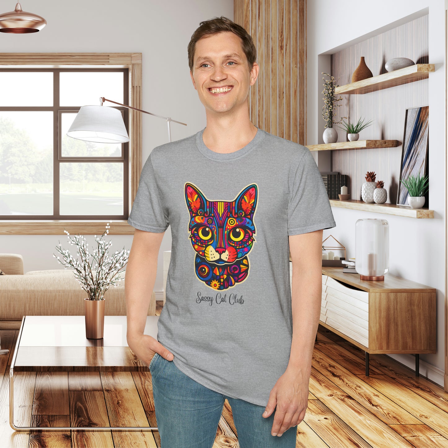 A mesmerizing cat that just pulls you to look into its eyes with “Sassy Cat Club” below it on this Unisex Softstyle T-Shirt.