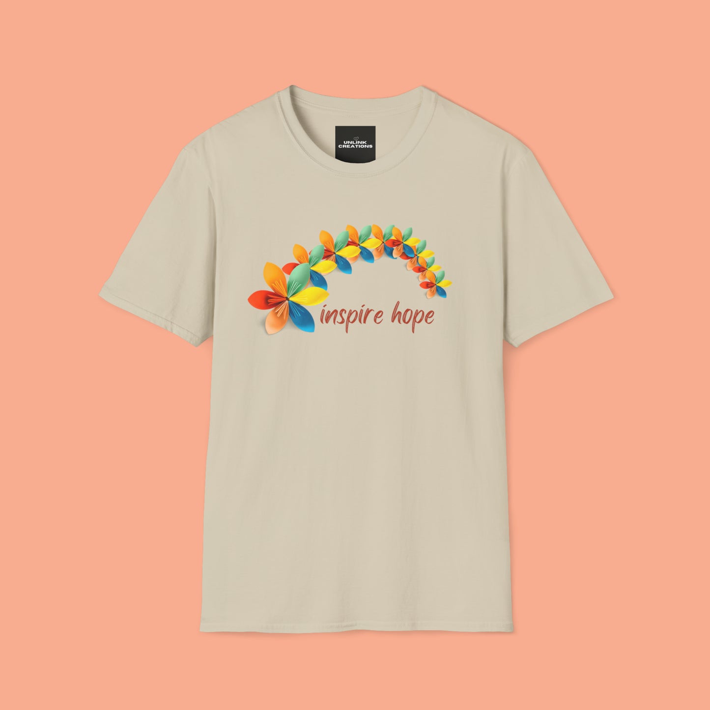 A beautiful origami style flowers in rainbow formation with “inspire hope” below it. We find hope in each other, that is part of our humanity. Be that inspiration, one person at a time. This is a Unisex Softstyle T-Shirt.