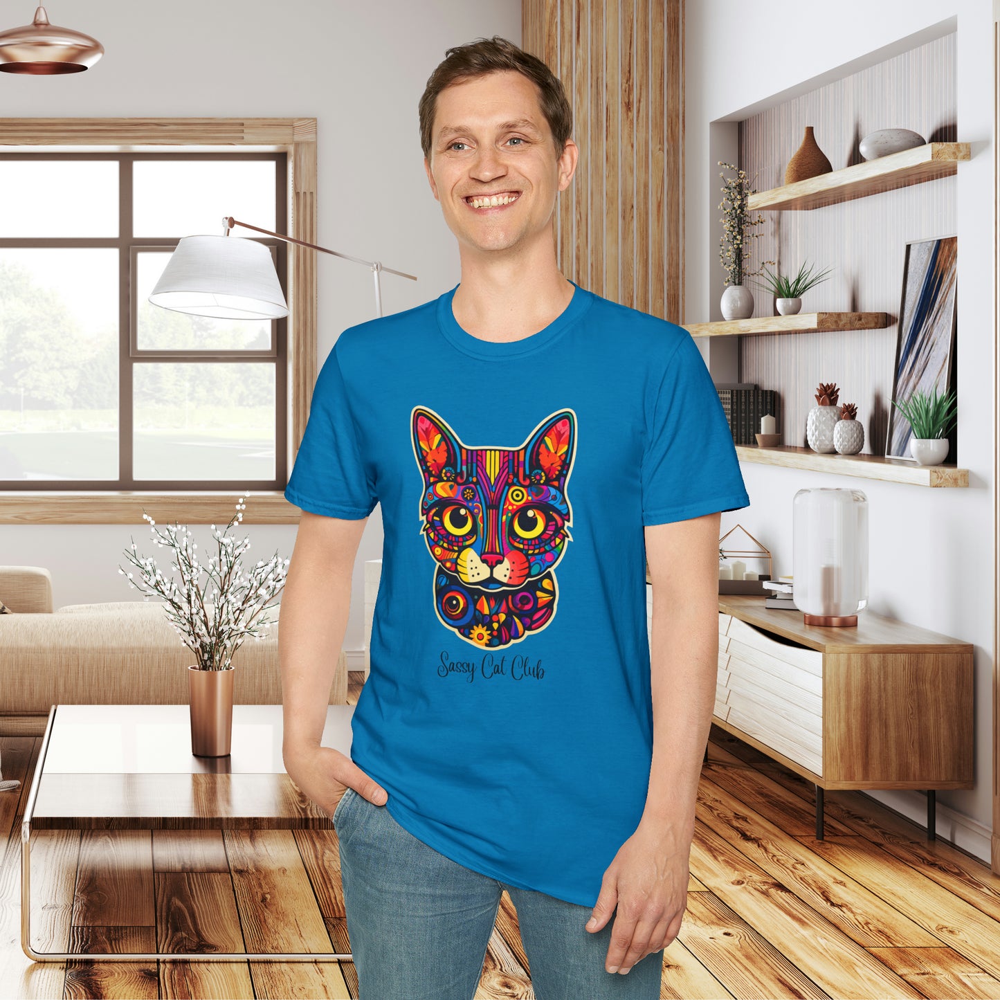 A mesmerizing cat that just pulls you to look into its eyes with “Sassy Cat Club” below it on this Unisex Softstyle T-Shirt.