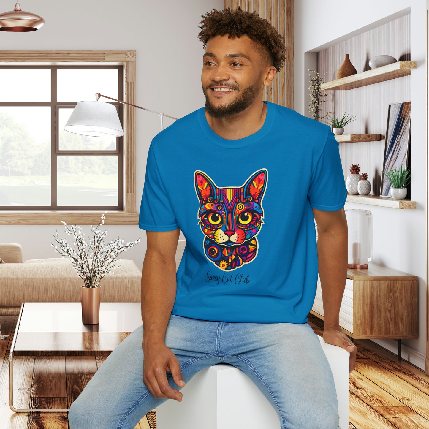 A mesmerizing cat that just pulls you to look into its eyes with “Sassy Cat Club” below it on this Unisex Softstyle T-Shirt.