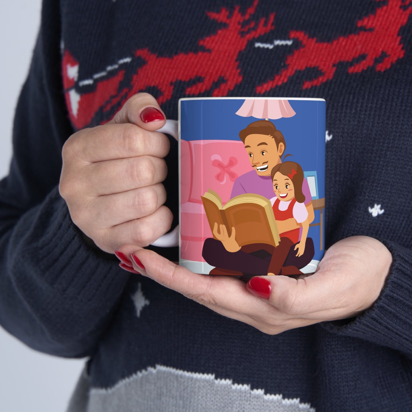 “BEST DAD EVER” on one side and dad reading to his baby. Part of several mugs to choose from depending on what resonates with you.