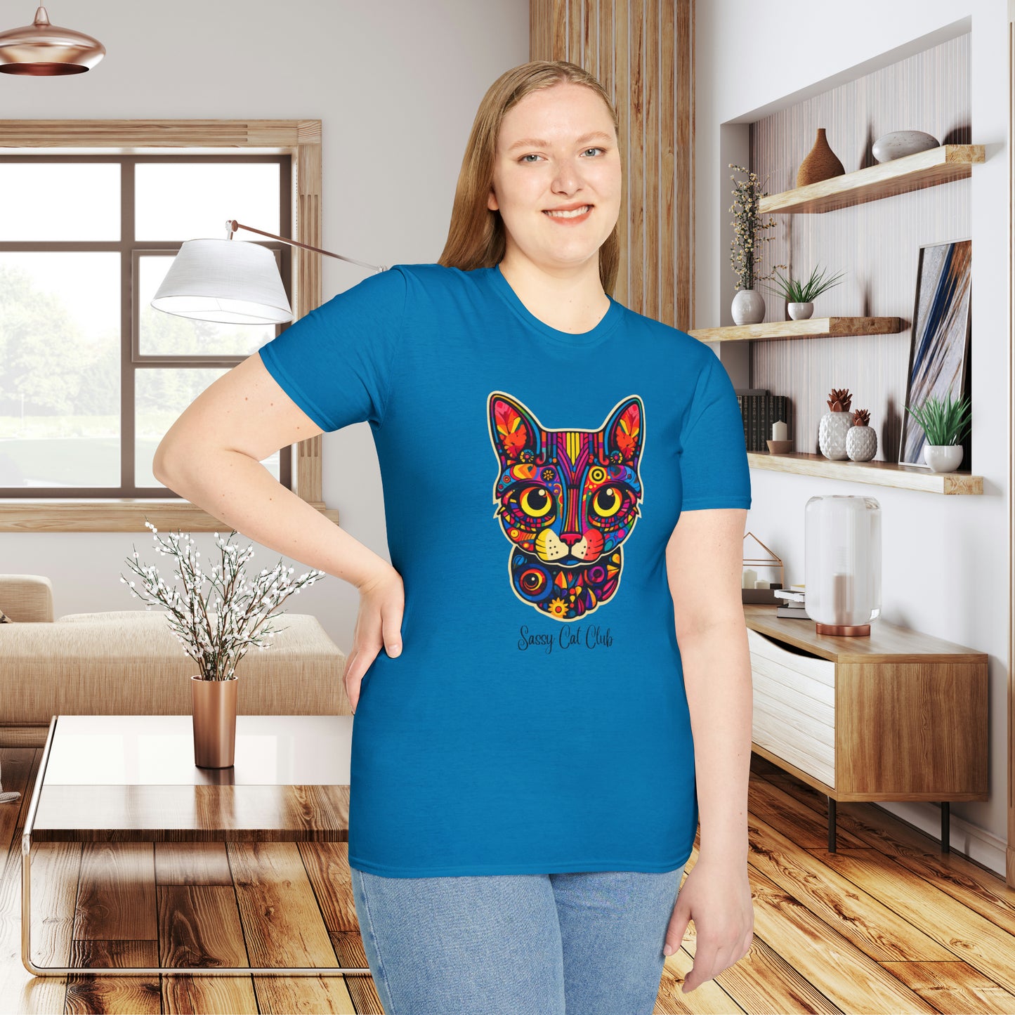 A mesmerizing cat that just pulls you to look into its eyes with “Sassy Cat Club” below it on this Unisex Softstyle T-Shirt.