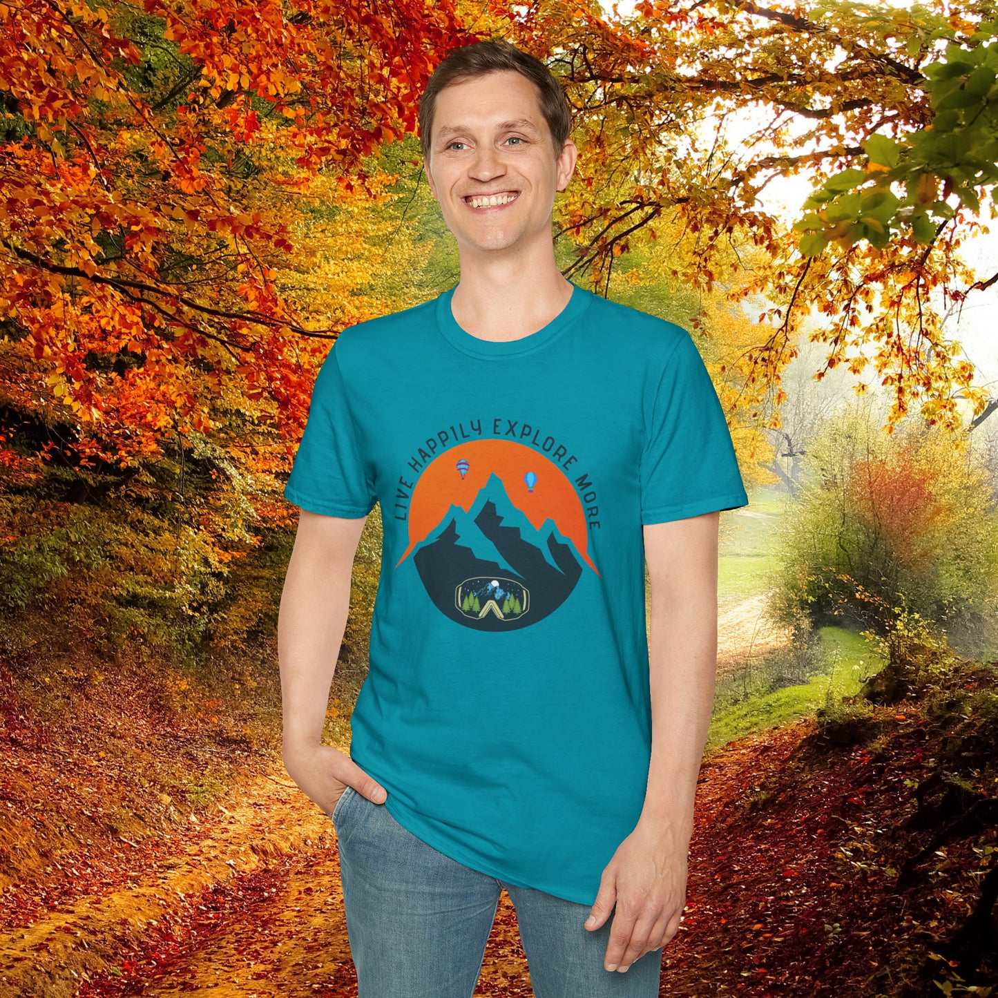 “LIVE HAPPILY EXPLORE MORE” message on this mountain sports inspired Unisex Softstyle T-Shirt.