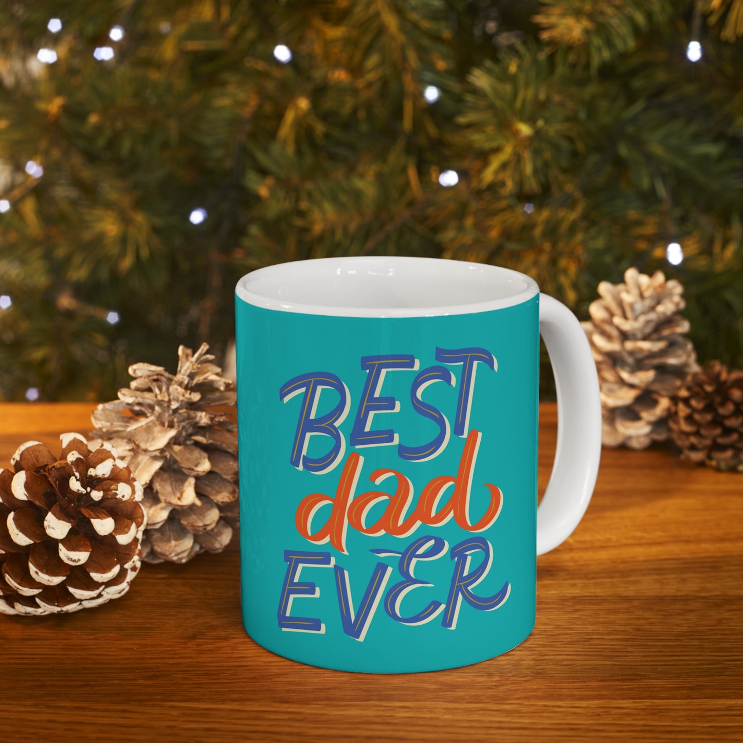 “BEST DAD EVER” on one side and dad dancing with his kid. Part of several mugs to choose from depending on what resonates with you.