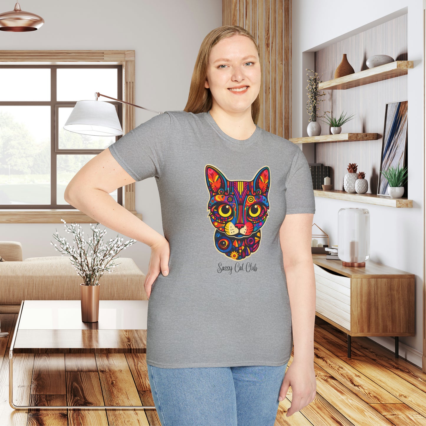 A mesmerizing cat that just pulls you to look into its eyes with “Sassy Cat Club” below it on this Unisex Softstyle T-Shirt.