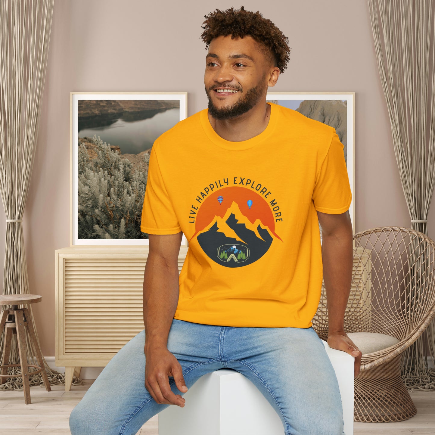 “LIVE HAPPILY EXPLORE MORE” message on this mountain sports inspired Unisex Softstyle T-Shirt.