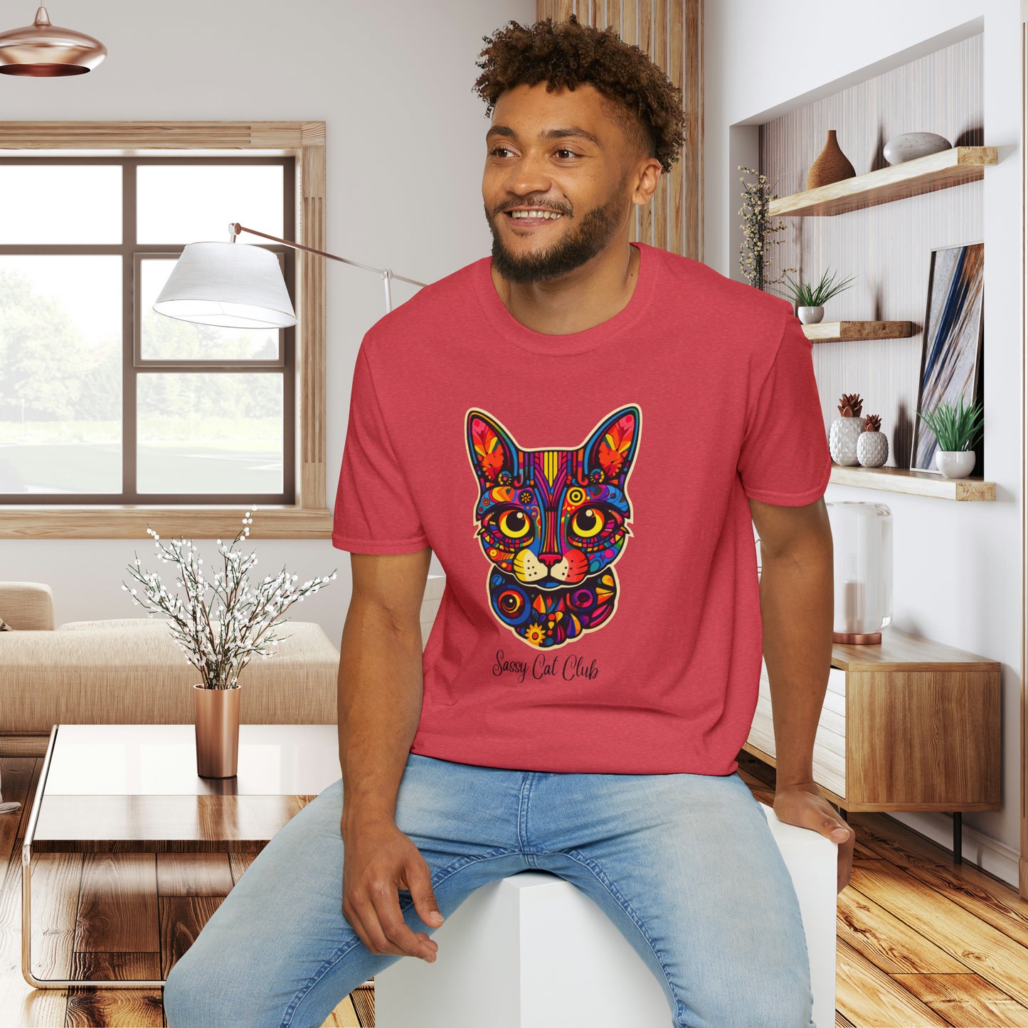 A mesmerizing cat that just pulls you to look into its eyes with “Sassy Cat Club” below it on this Unisex Softstyle T-Shirt.