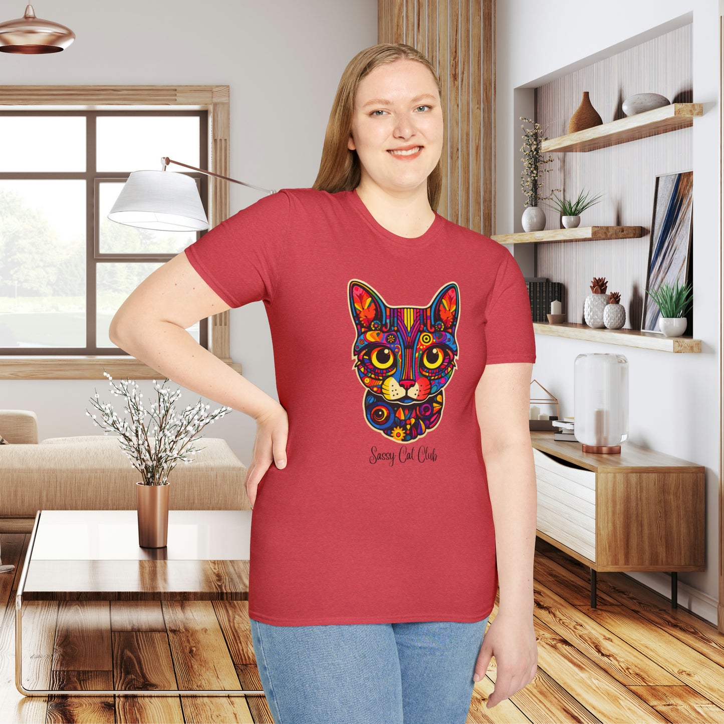 A mesmerizing cat that just pulls you to look into its eyes with “Sassy Cat Club” below it on this Unisex Softstyle T-Shirt.