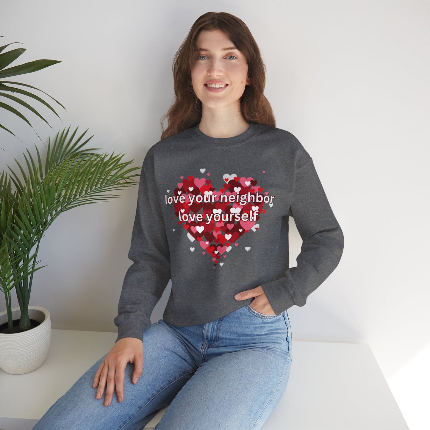 “love your neighbor love yourself” on top of a beautiful heart of hearts. Give the gift of this Unisex Heavy Blend™ Crewneck Sweatshirt or get one for yourself.