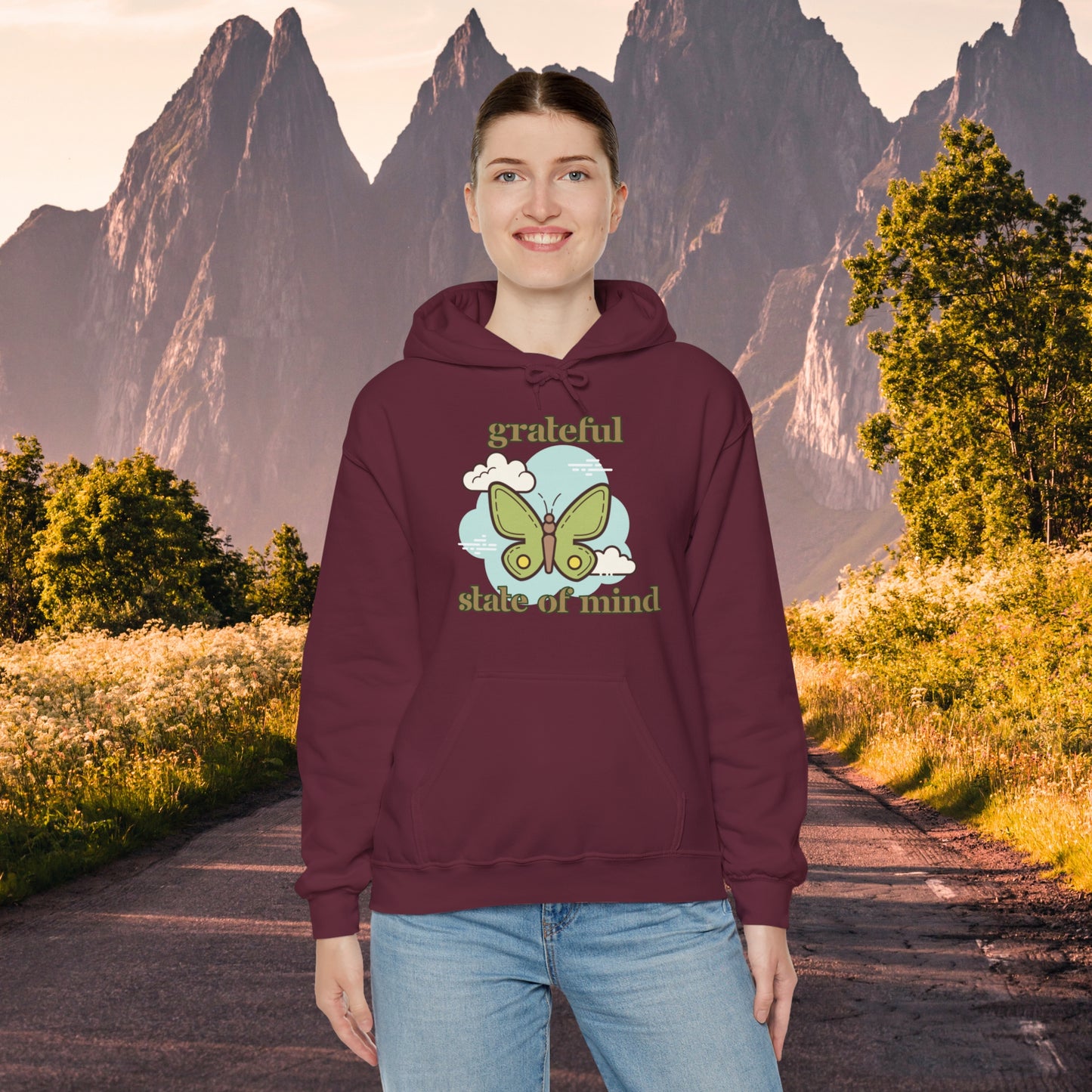 Grateful state of mind around a simple butterfly design on this Unisex Heavy Blend™ Hooded Sweatshirt