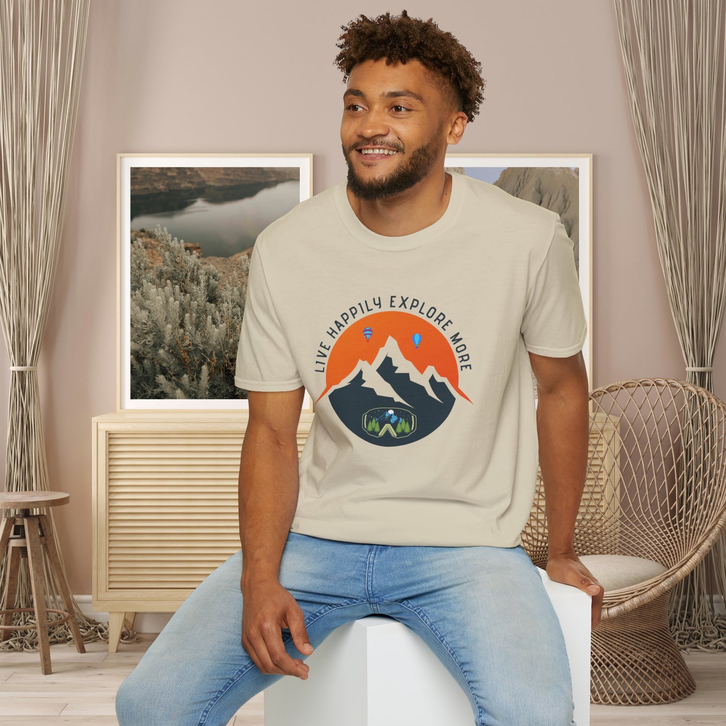 “LIVE HAPPILY EXPLORE MORE” message on this mountain sports inspired Unisex Softstyle T-Shirt.