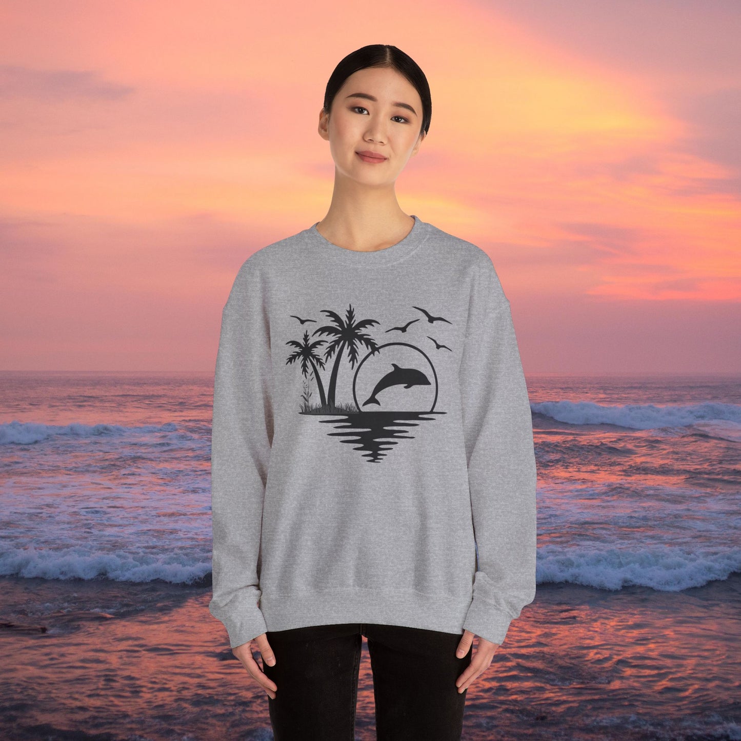 Silhouettes of palm trees, playful dolphin, and the ocean water make this cozy sweatshirt. Give the gift of this Unisex Heavy Blend™ Crewneck Sweatshirt or get one for yourself.