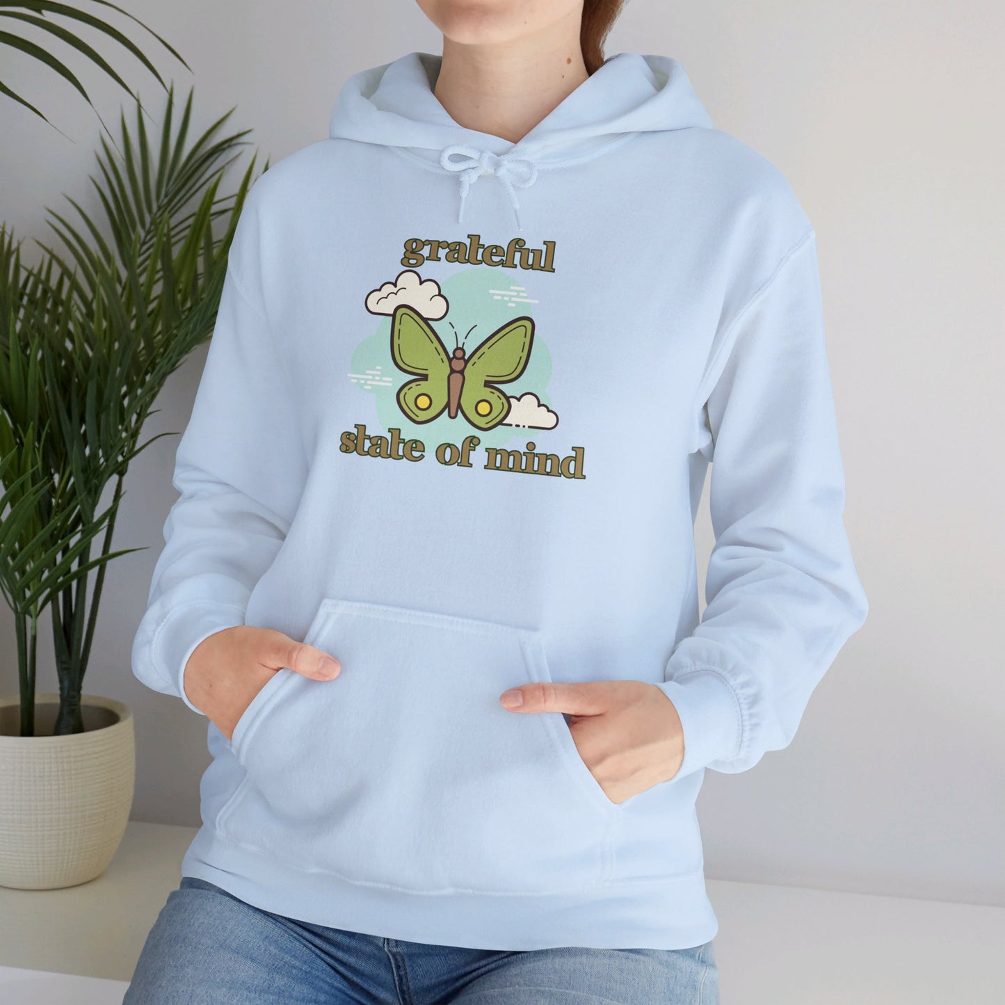 Grateful state of mind around a simple butterfly design on this Unisex Heavy Blend™ Hooded Sweatshirt