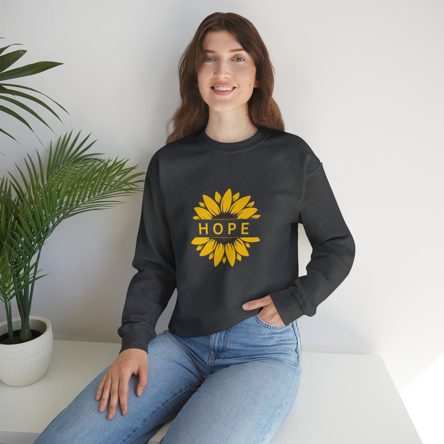 Beautiful sunflower with to inspire  “HOPE” comfy sweatshirt. Give the gift of this Unisex Heavy Blend™ Crewneck Sweatshirt or get one for yourself.