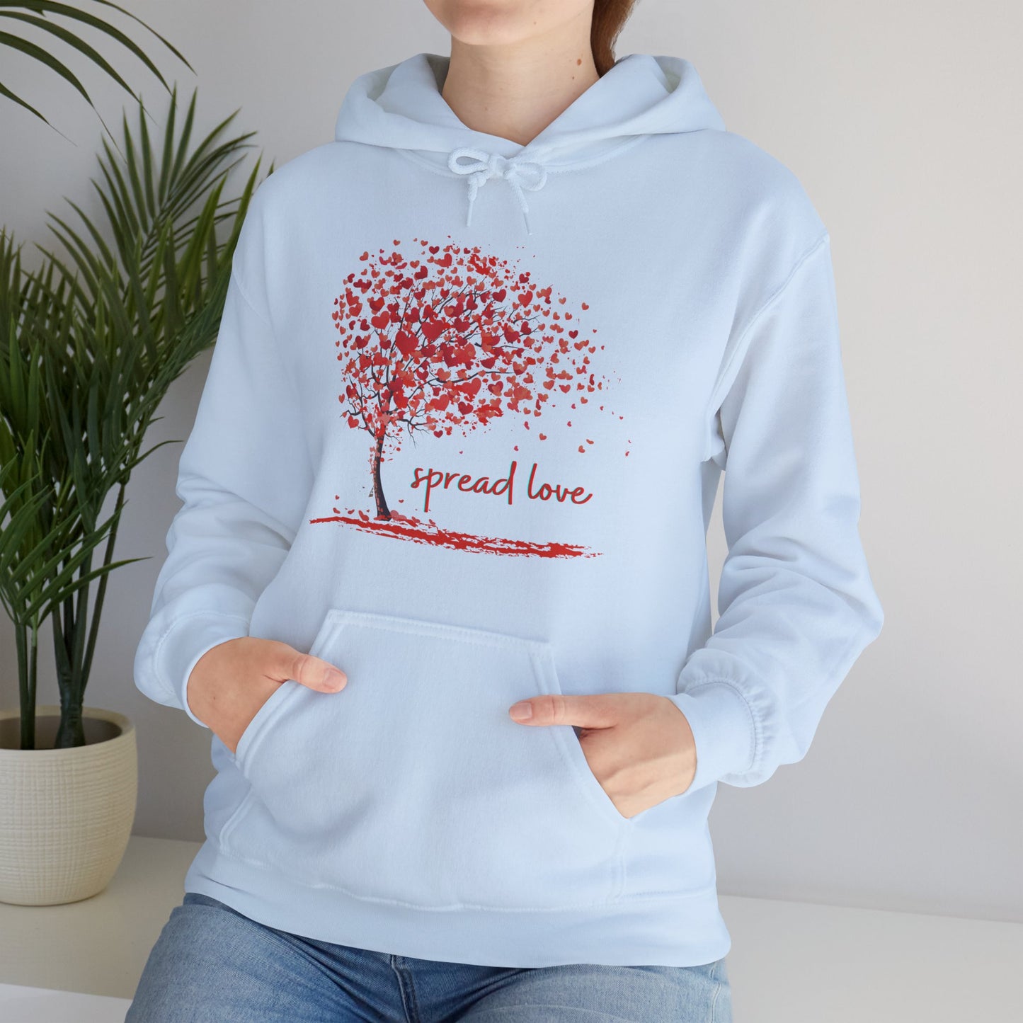 Spread love is the message on this heart filled tree designed Unisex Heavy Blend™ Hooded Sweatshirt