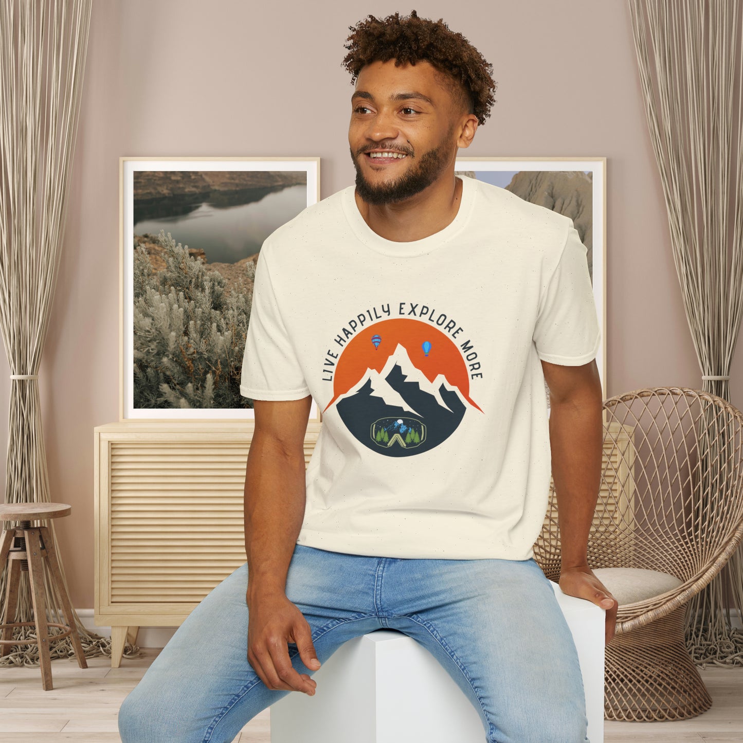 “LIVE HAPPILY EXPLORE MORE” message on this mountain sports inspired Unisex Softstyle T-Shirt.