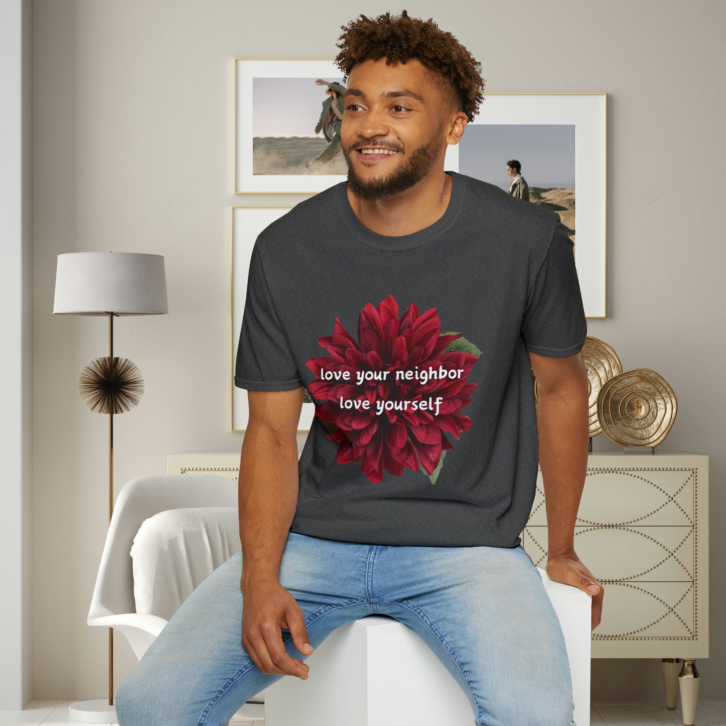 A message of “love your neighbor love yourself” over a beautiful red flower. This is a Unisex Softstyle T-Shirt.