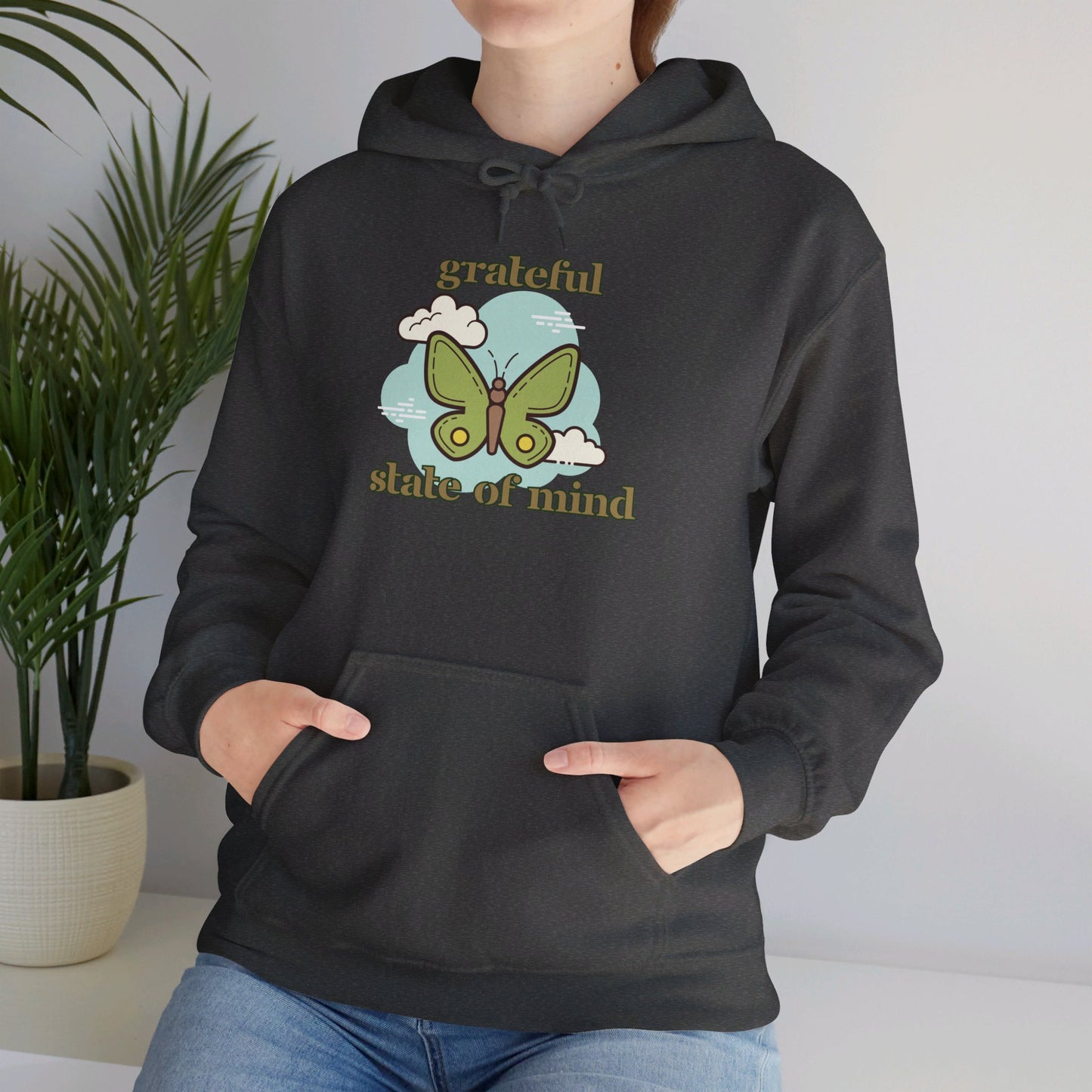 Grateful state of mind around a simple butterfly design on this Unisex Heavy Blend™ Hooded Sweatshirt