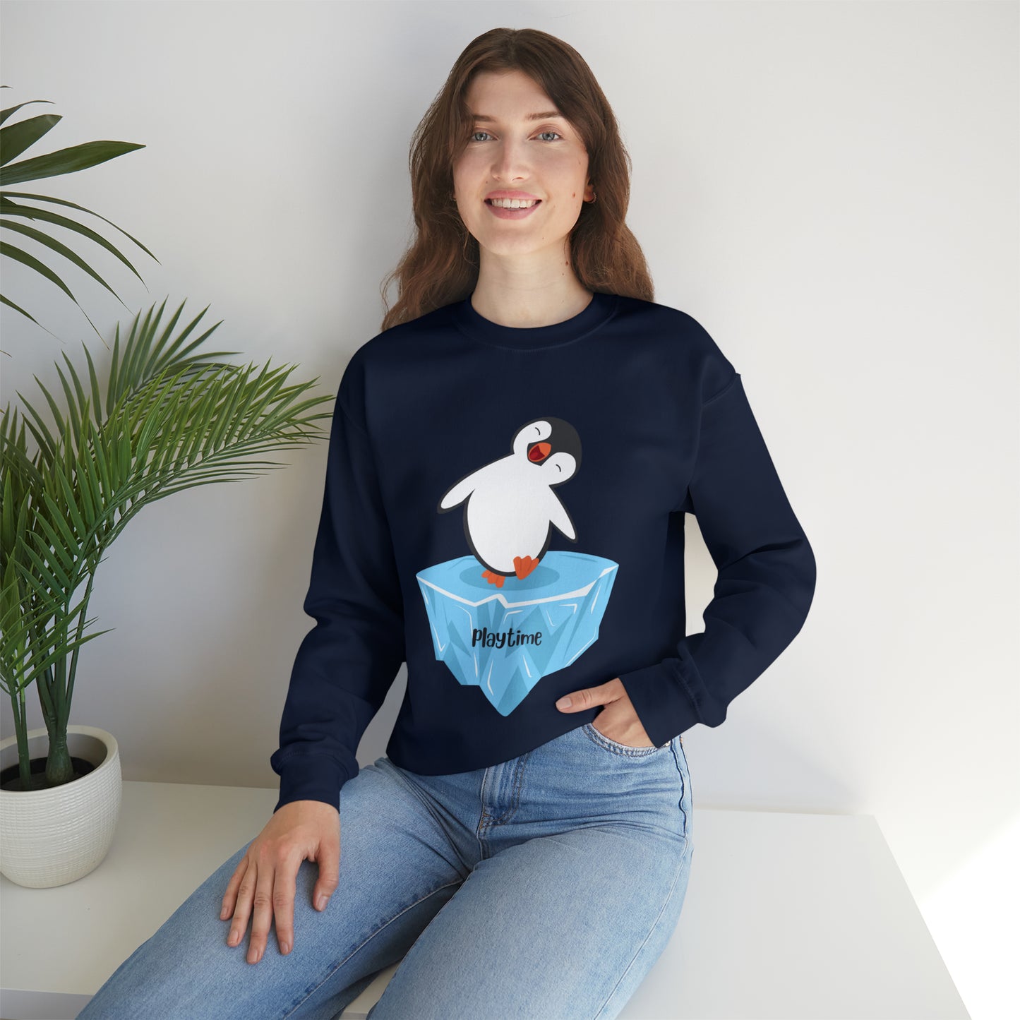 Playtime! Cute and happy penguin on an iceberg design. Give the gift of this Unisex Heavy Blend™ Crewneck Sweatshirt or get one for yourself.