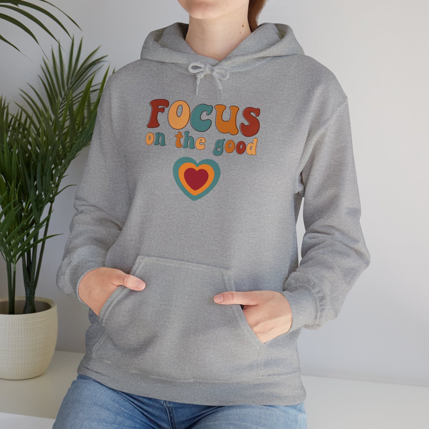 A colorful Focus on the good message on this Unisex Heavy Blend™ Hooded Sweatshirt