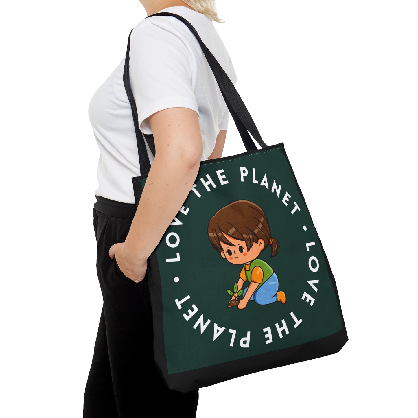 Caring kid planting a tree inside a  “LOVE THE PLANET” Tote Bag in 3 sizes to meet your needs. Available in black.