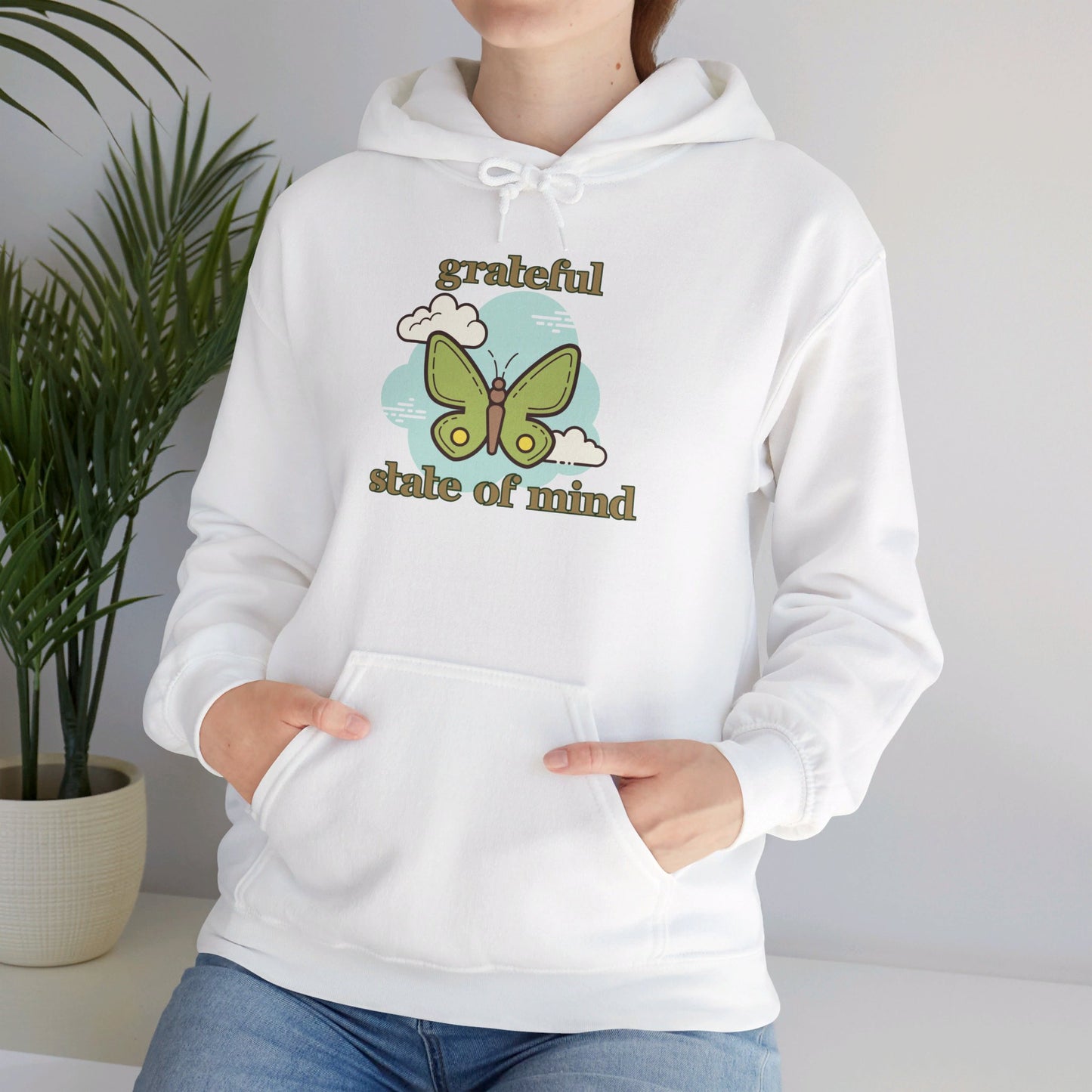 Grateful state of mind around a simple butterfly design on this Unisex Heavy Blend™ Hooded Sweatshirt