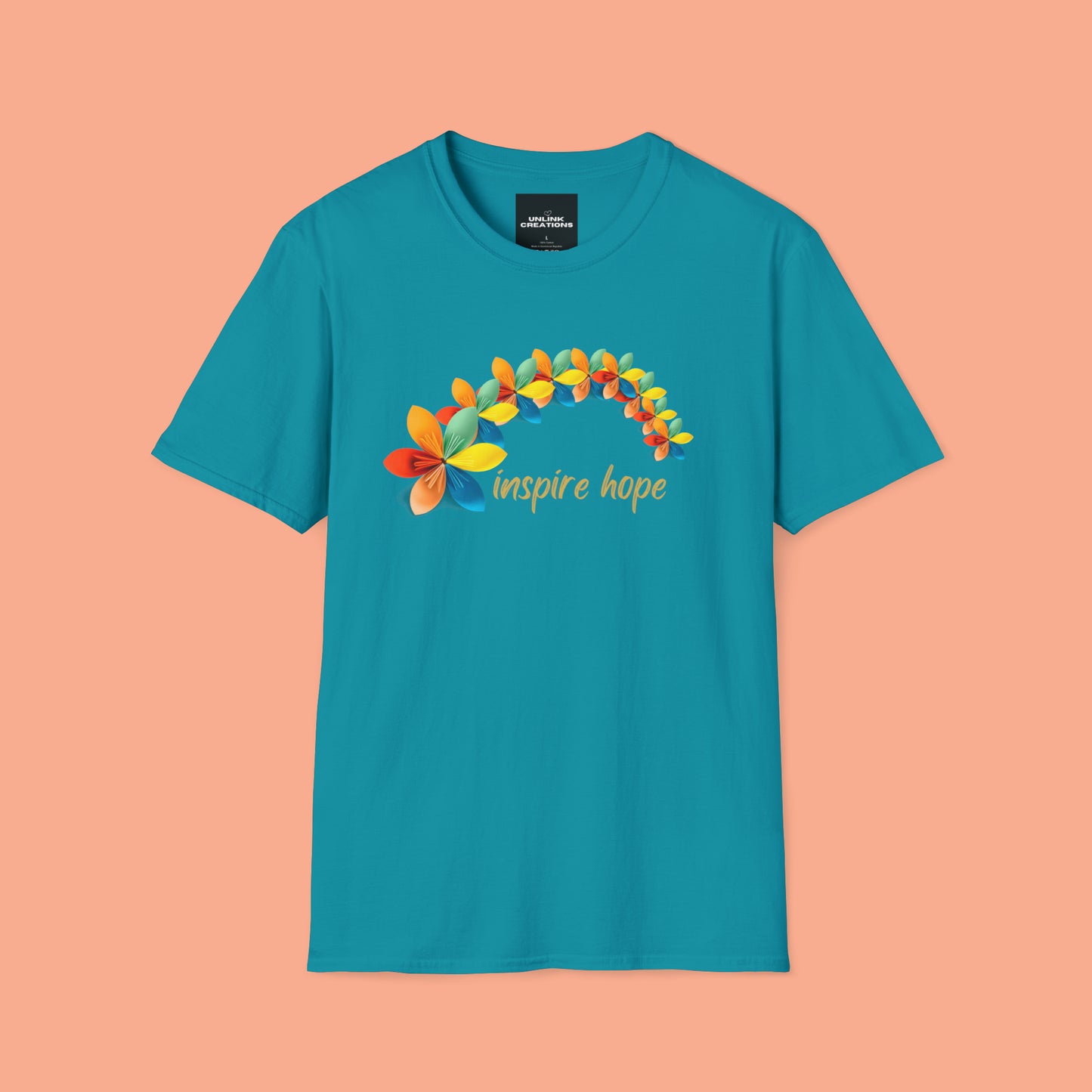 A beautiful origami style flowers in rainbow formation with “inspire hope” below it. We find hope in each other, that is part of our humanity. Be that inspiration, one person at a time. This is a Unisex Softstyle T-Shirt.