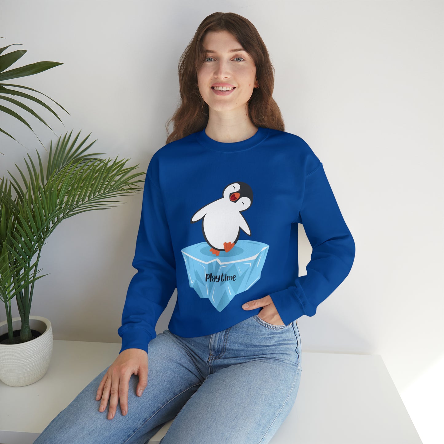 Playtime! Cute and happy penguin on an iceberg design. Give the gift of this Unisex Heavy Blend™ Crewneck Sweatshirt or get one for yourself.