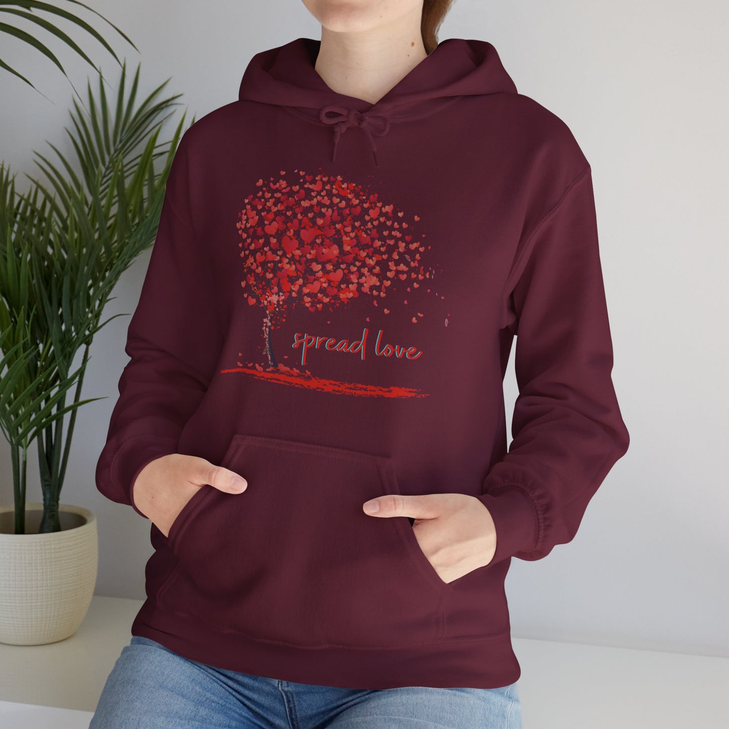 Spread love is the message on this heart filled tree designed Unisex Heavy Blend™ Hooded Sweatshirt