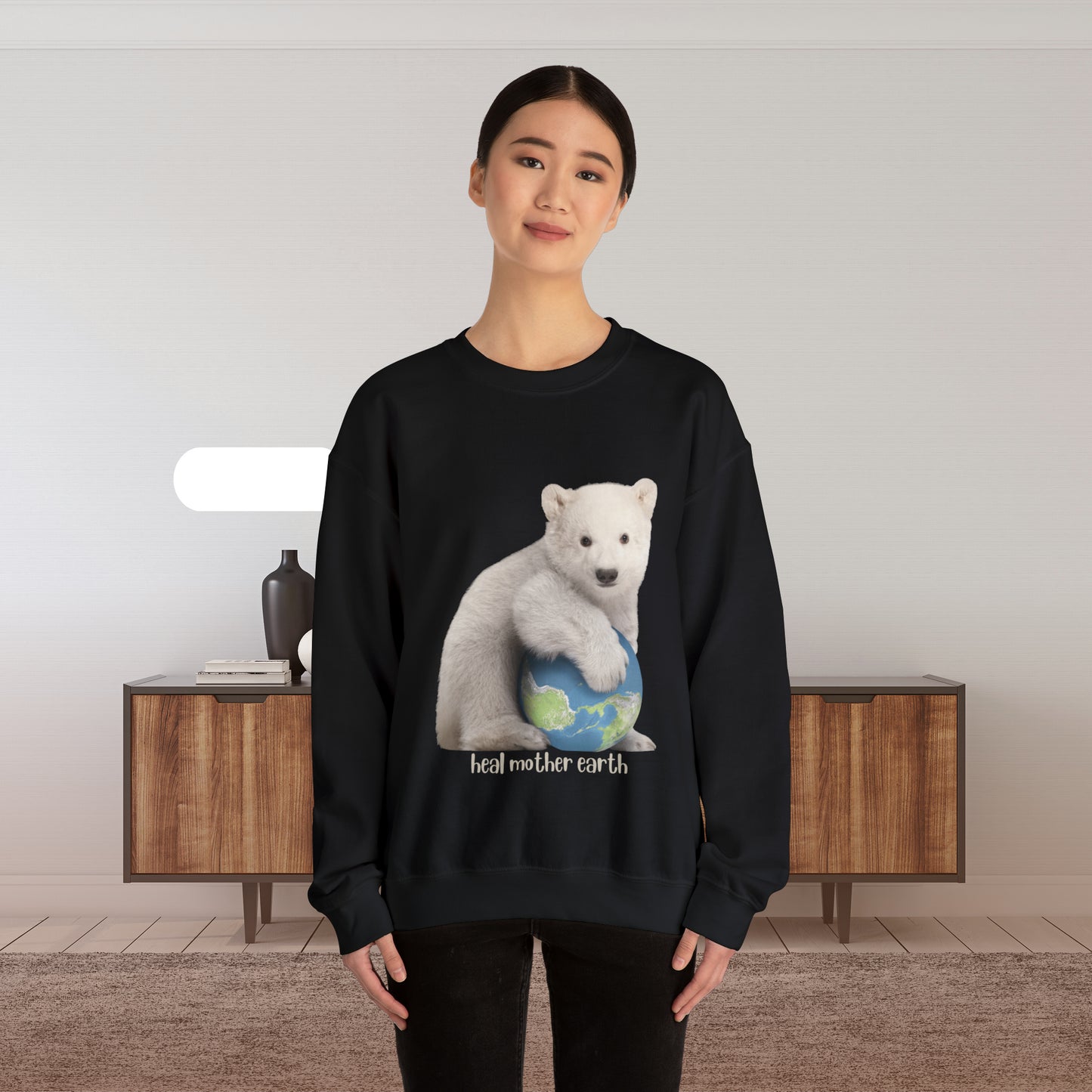 Adorable polar bear cub hugging Mother Earth and asks us to “Heal Mother Earth. ! We can do it together! Give the gift of this Unisex Heavy Blend™ Crewneck Sweatshirt or get one for yourself.