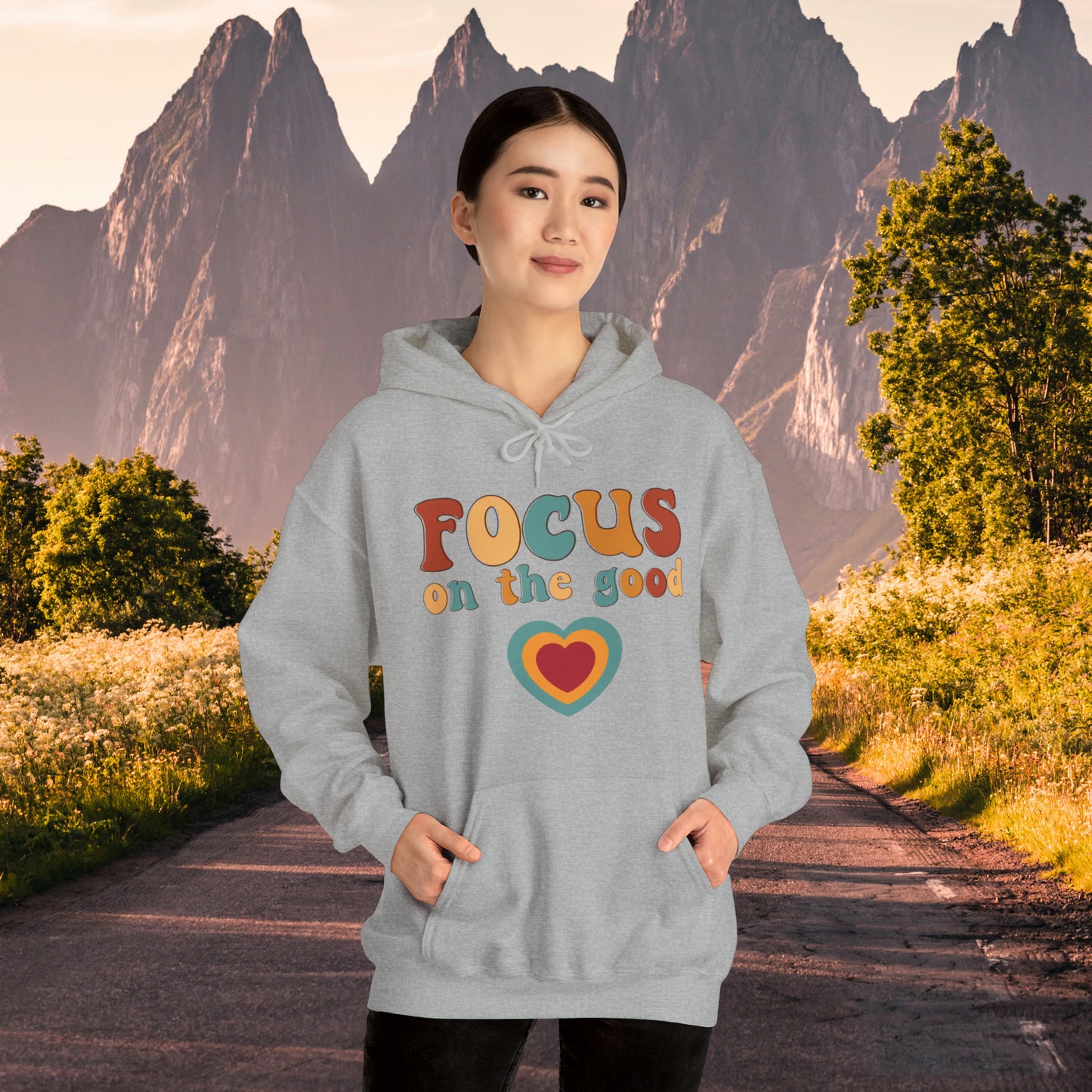 A colorful Focus on the good message on this Unisex Heavy Blend™ Hooded Sweatshirt