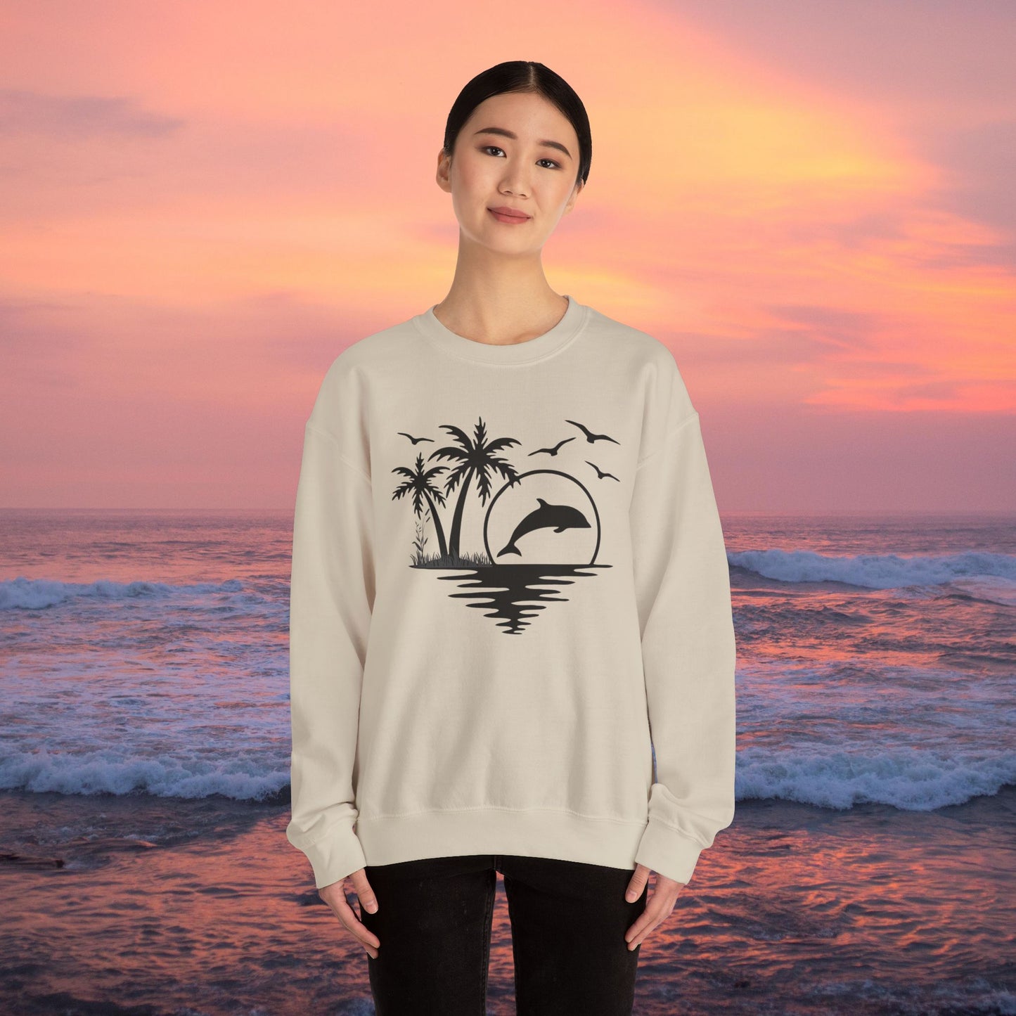 Silhouettes of palm trees, playful dolphin, and the ocean water make this cozy sweatshirt. Give the gift of this Unisex Heavy Blend™ Crewneck Sweatshirt or get one for yourself.