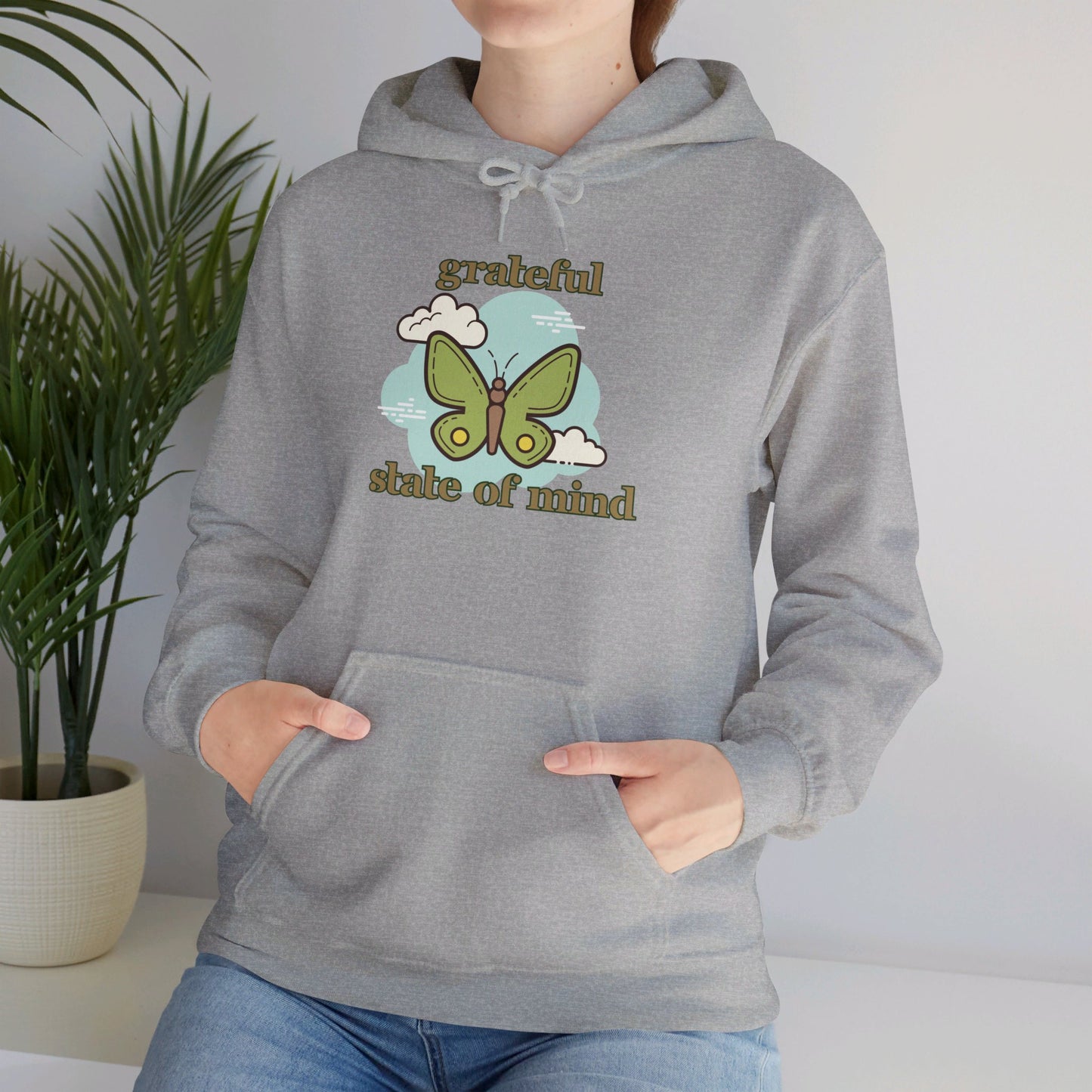 Grateful state of mind around a simple butterfly design on this Unisex Heavy Blend™ Hooded Sweatshirt