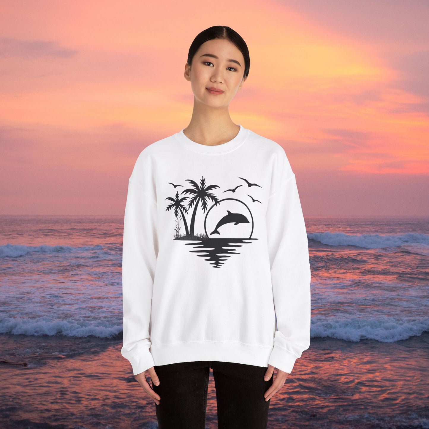 Silhouettes of palm trees, playful dolphin, and the ocean water make this cozy sweatshirt. Give the gift of this Unisex Heavy Blend™ Crewneck Sweatshirt or get one for yourself.