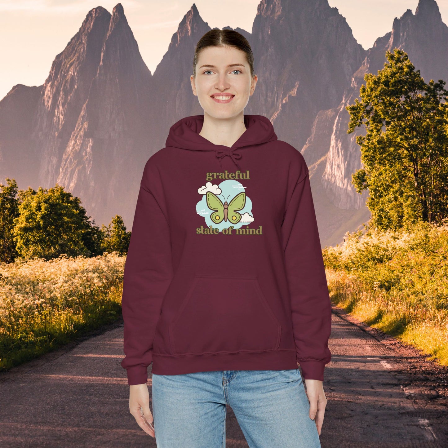 Grateful state of mind around a simple butterfly design on this Unisex Heavy Blend™ Hooded Sweatshirt