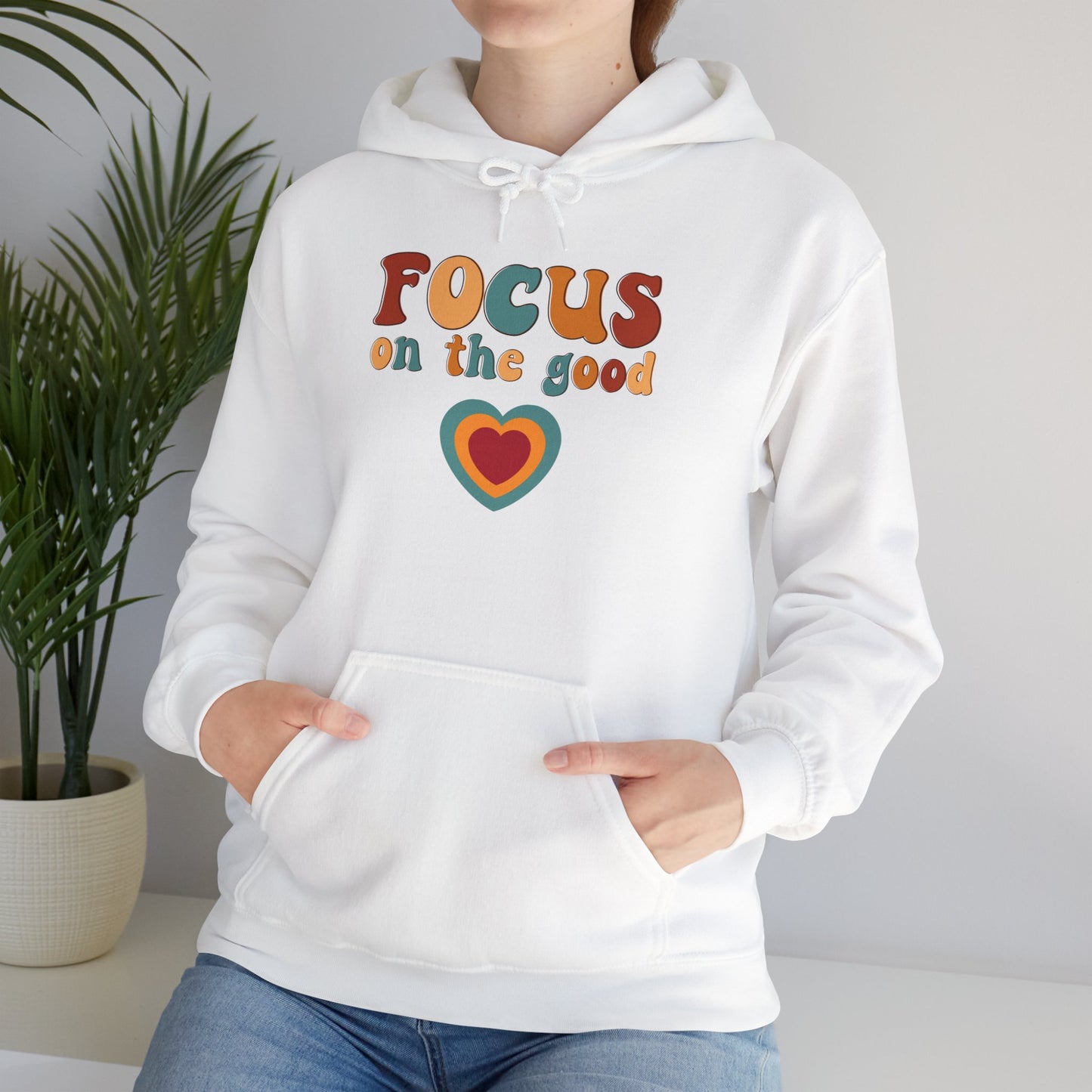 A colorful Focus on the good message on this Unisex Heavy Blend™ Hooded Sweatshirt