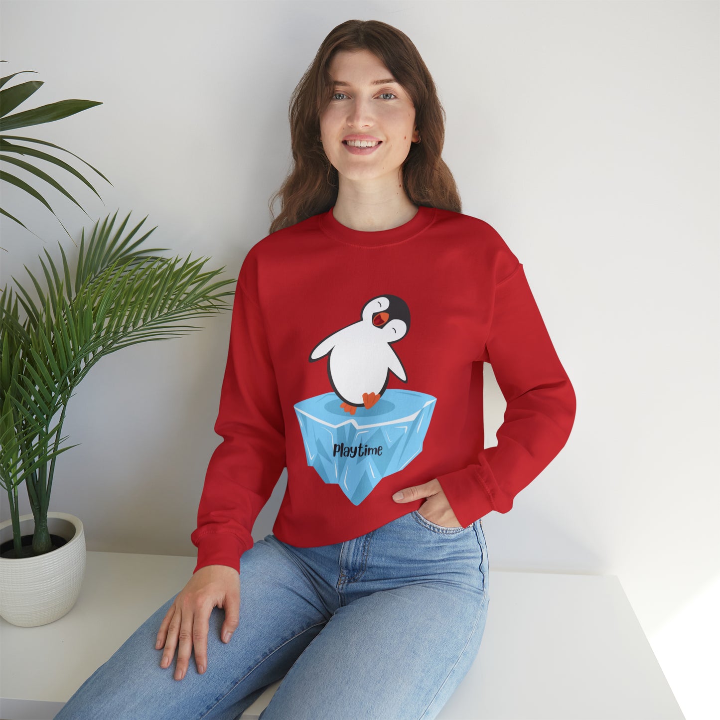 Playtime! Cute and happy penguin on an iceberg design. Give the gift of this Unisex Heavy Blend™ Crewneck Sweatshirt or get one for yourself.