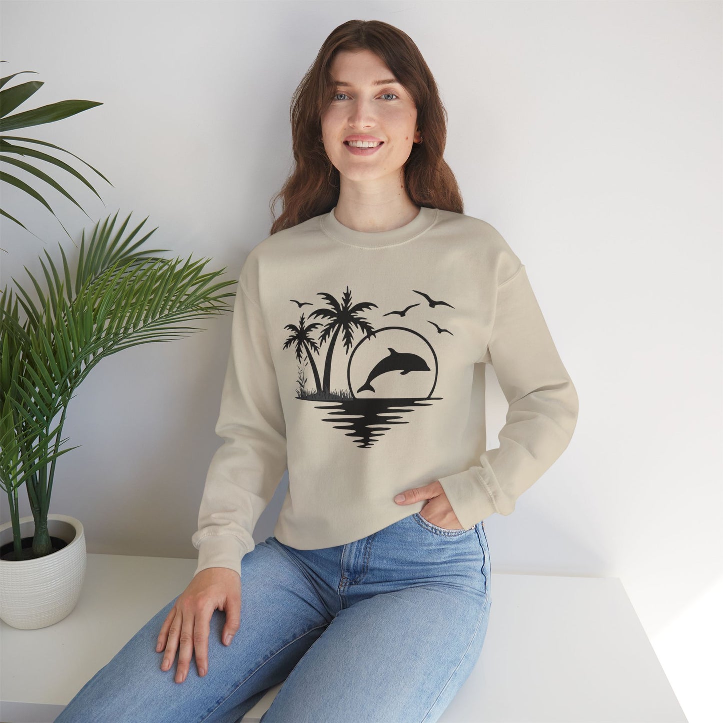 Silhouettes of palm trees, playful dolphin, and the ocean water make this cozy sweatshirt. Give the gift of this Unisex Heavy Blend™ Crewneck Sweatshirt or get one for yourself.