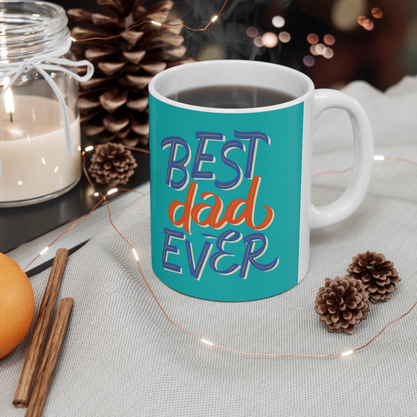 “BEST DAD EVER” on one side and dad dancing with his kid. Part of several mugs to choose from depending on what resonates with you.