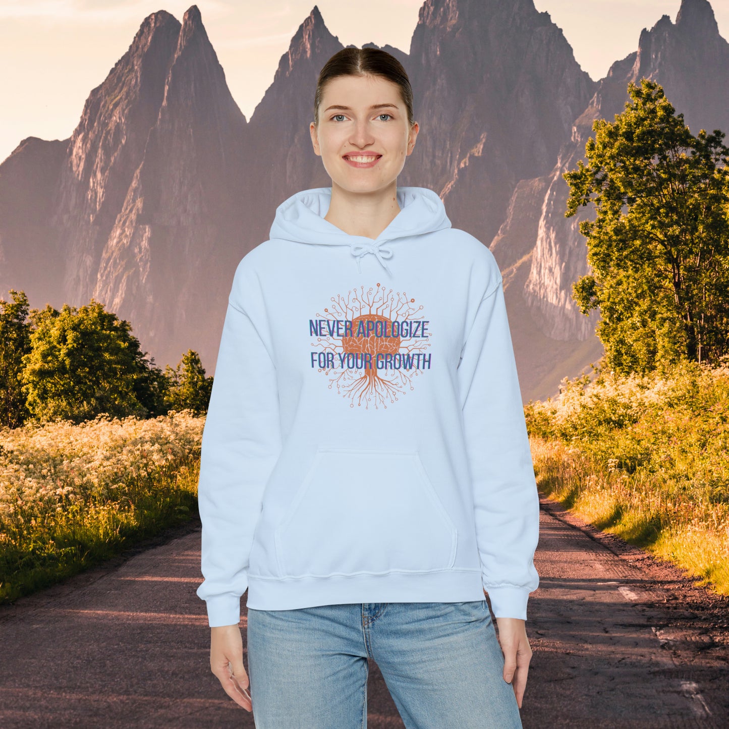 Never apologize for your growth message on this Unisex Heavy Blend™ Hooded Sweatshirt