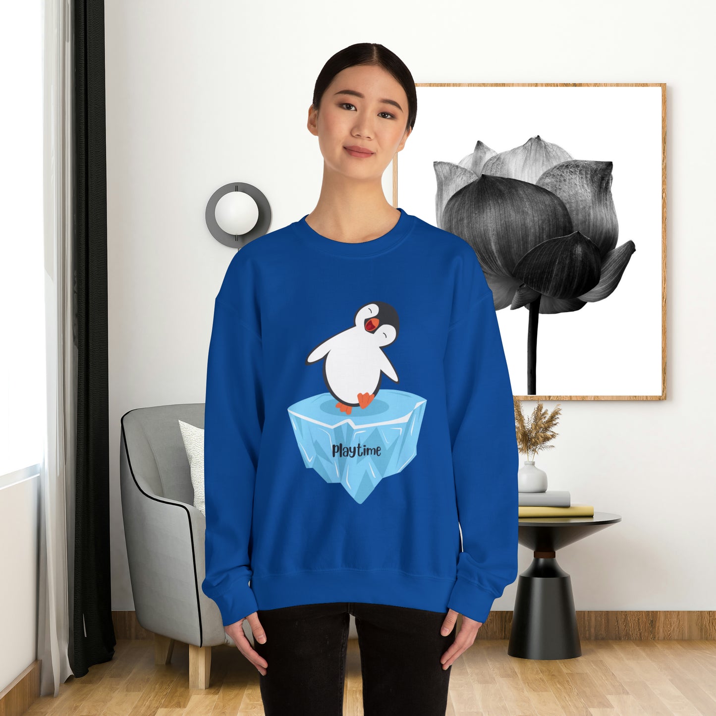 Playtime! Cute and happy penguin on an iceberg design. Give the gift of this Unisex Heavy Blend™ Crewneck Sweatshirt or get one for yourself.