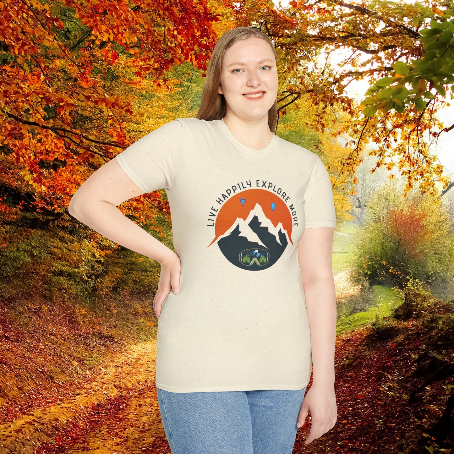 “LIVE HAPPILY EXPLORE MORE” message on this mountain sports inspired Unisex Softstyle T-Shirt.