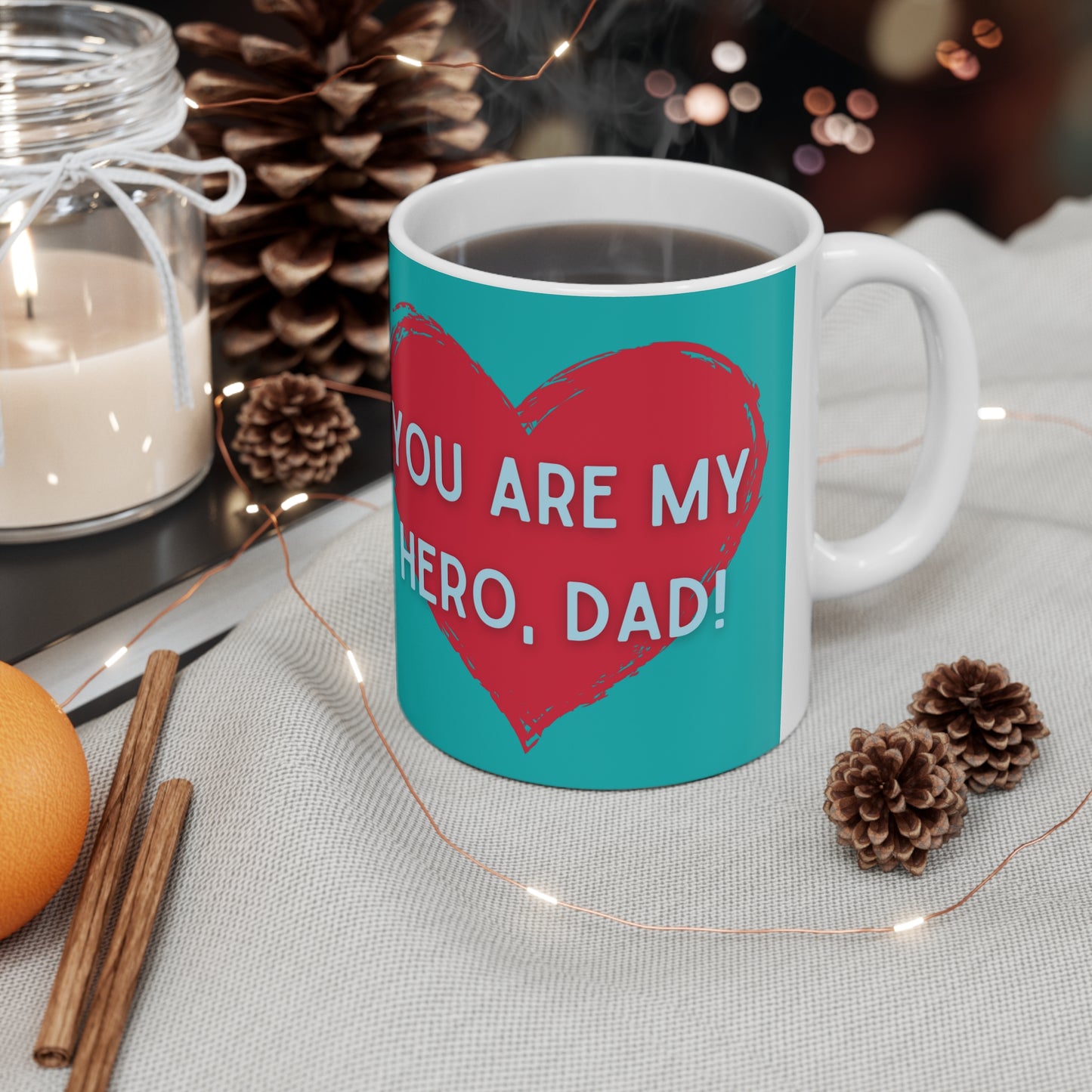 “YOU ARE MY HERO, DAD” on one side and a happy time shared by dad and daughter. Part of several mugs to choose from depending on what resonates with you.