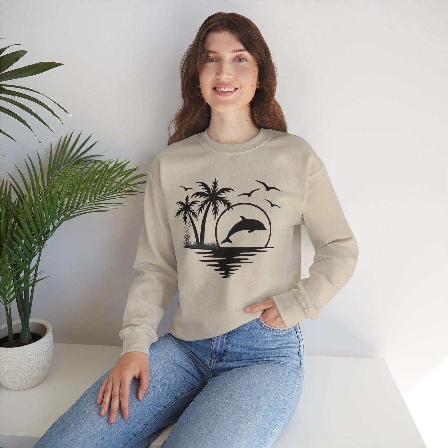 Silhouettes of palm trees, playful dolphin, and the ocean water make this cozy sweatshirt. Give the gift of this Unisex Heavy Blend™ Crewneck Sweatshirt or get one for yourself.