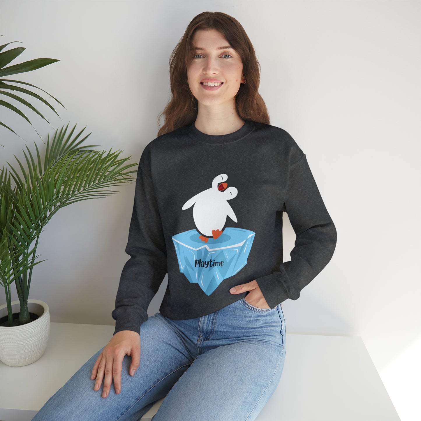 Playtime! Cute and happy penguin on an iceberg design. Give the gift of this Unisex Heavy Blend™ Crewneck Sweatshirt or get one for yourself.